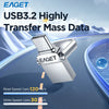 A silver metal flash drive labeled EAGET is shown in a dynamic, high-speed context against a blue and white background.