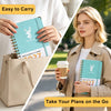 A woman holds a light beige tote bag and a teal notebook planner with a deer design, ready to take plans on the go.