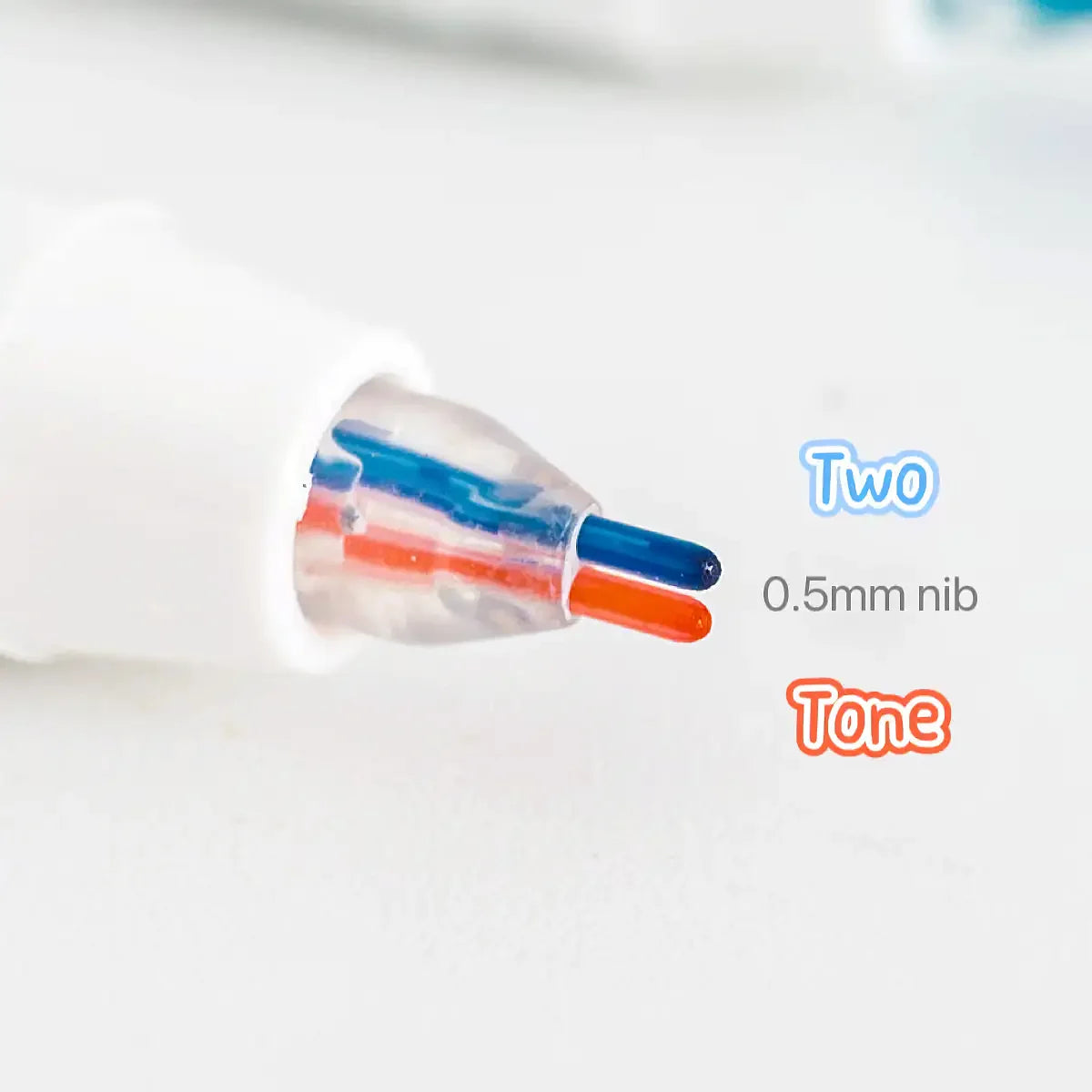 Close-up of a line marker pen tip showing two colors, blue and orange, on a white background.