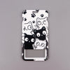 A white card holder featuring various cartoon cats in black and gray designs.