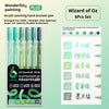 A set of six multi-color acrylic painting gel pens with green and yellow tips packaged in a box.