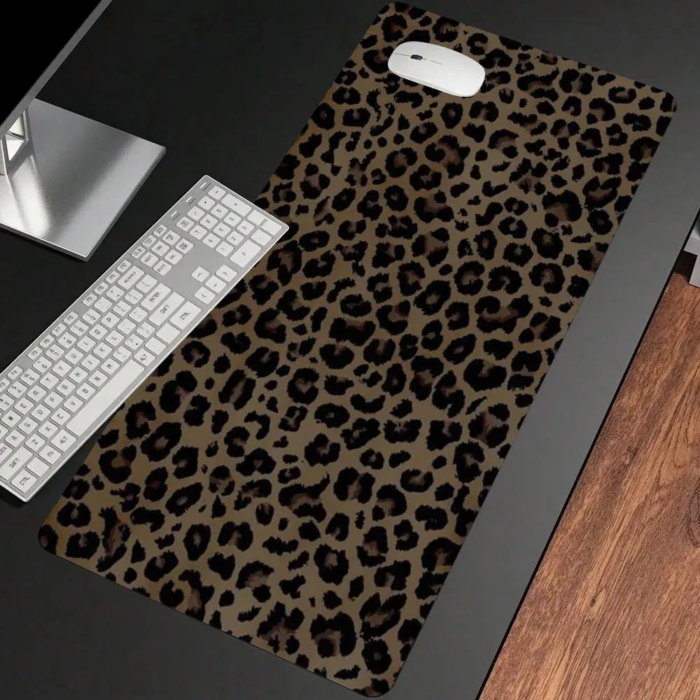 A dark brown leopard print non-slip gaming mouse pad with a white computer mouse resting on it.