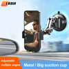 A phone is mounted on a metal suction cup car mount with an articulating arm, showing a man looking out the window.
