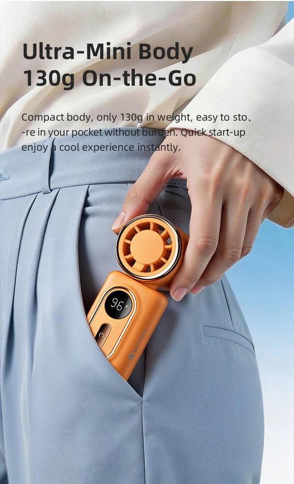 A hand is showing an orange portable handheld cooling fan, which is compact and designed for on-the-go use.