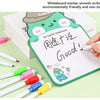 A white board marker is used to write Good! on a board featuring a happy dinosaur design.