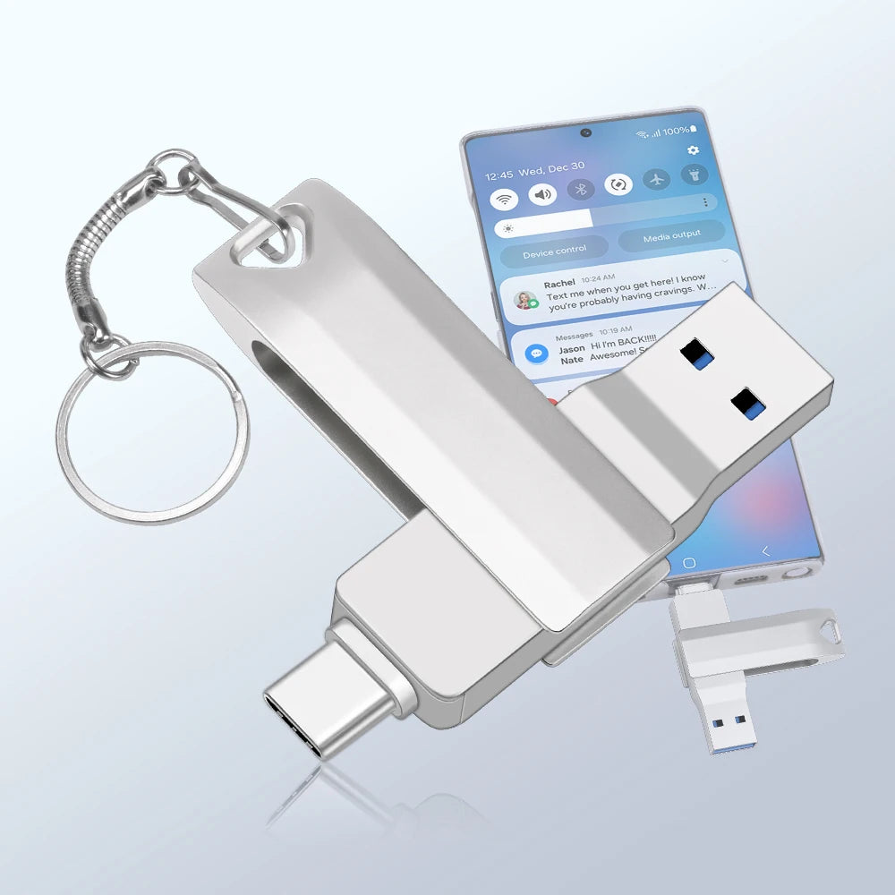A silver metal body USB-C flash drive is shown next to a smartphone displaying a text message.