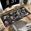 A black gaming mouse pad featuring characters from The Coffin of Andy and Leyley