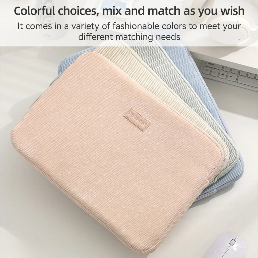 A stack of colorful fabric laptop sleeves in pastel shades, including pink and blue, displayed on a white surface.