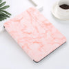 A pink marble-patterned silicone skin for an iPad Pro resting on a white surface.