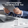 Hands hold a tablet while a white fast charging cable connects to a charging block.