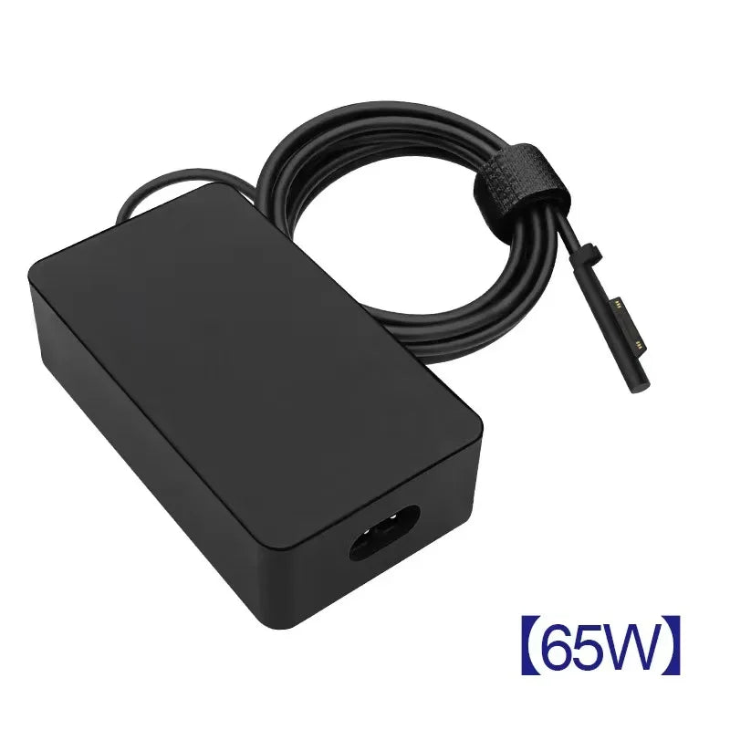 Black universal tablet charger with a coiled cable and a connector for Surface devices