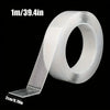 Roll of 1m/39.4in heavy duty double-sided transparent mounting tape with a 2cm/0.79in strip shown on the side
