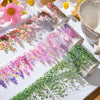 Transparent PET washi tape featuring a delicate floral vine design in pink, purple, and green hues.