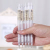 A hand holds a set of minimalist mechanical pencils with 0.5mm and 0.7mm tips.