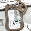 A brown card holder with a clear insert and a beaded keychain attached, featuring a silhouette of a cat.