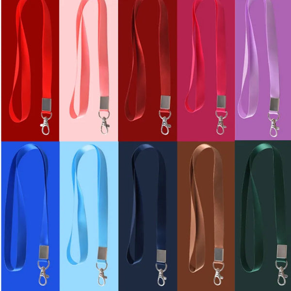 A collection of durable ID badge holder lanyards in various colors including red, pink, purple, and blue.