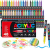 A collection of 48 acrylic brush markers in various colors and tips displayed in a box with paint spills.