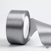 A roll of silver satin ribbon for gift wrapping and DIY crafts.