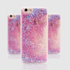 A close-up of a clear phone case filled with pink and purple glitter liquid featuring dynamic star effects.