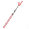 A pink adjustable telescopic reading stick with a hand shape at the top.