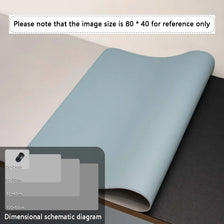 A light blue premium PU leather desk mat rolled up, shown in a close-up view.