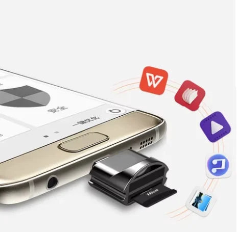 A close-up view of a Universal Type-C to Micro-SD Card Reader device placed next to a smartphone.