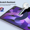 A close-up of a tablet screen showing a purple abstract design with a silver key resting on the glass.