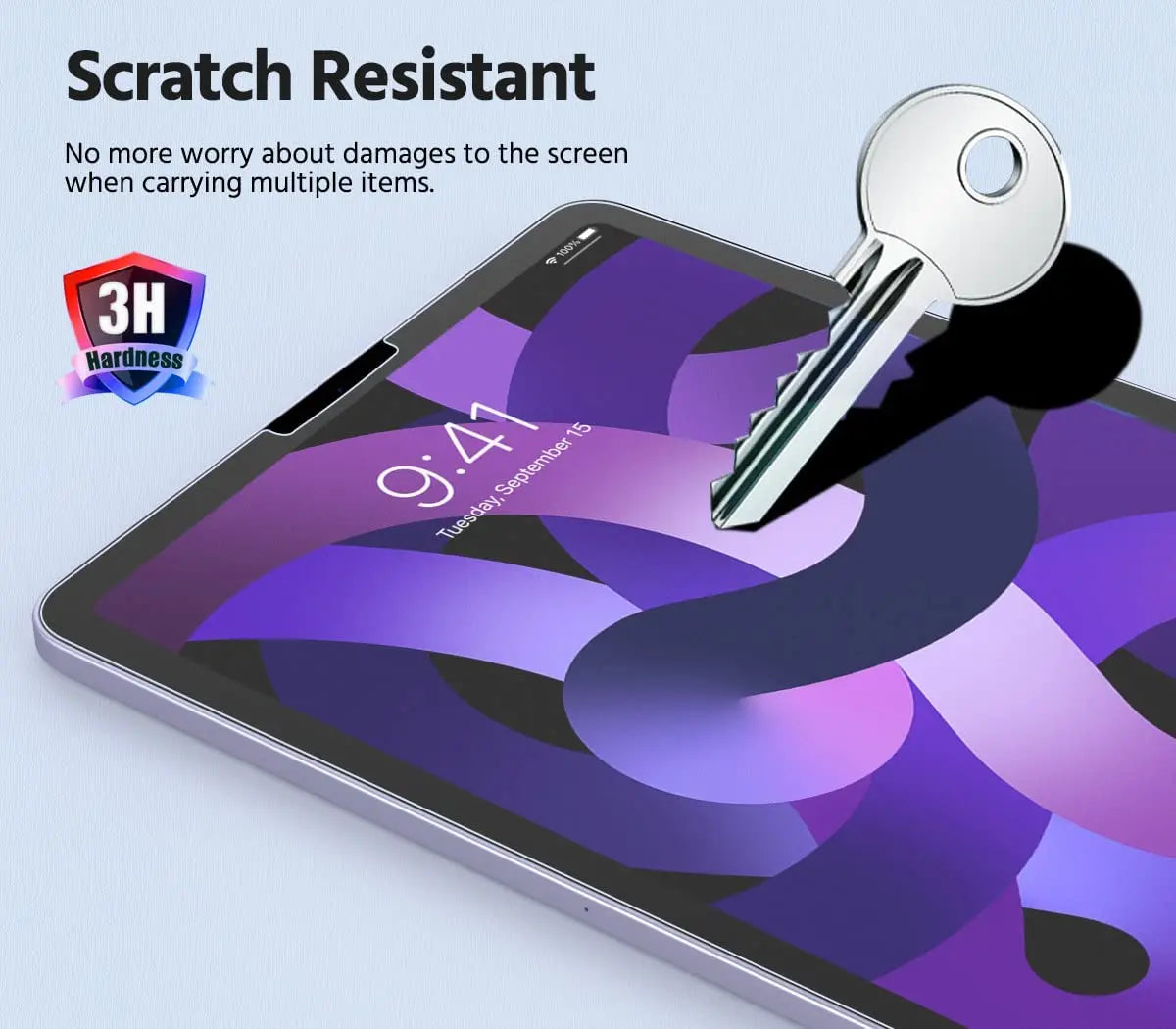 A close-up of a tablet screen showing a purple abstract design with a silver key resting on the glass.