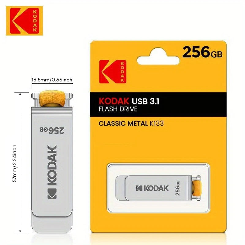 A yellow packaging box for a Kodak USB 3.1 Flash Drive labeled 256GB with a silver drive inside.