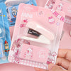 A pink plastic case containing a mini cartoon stapler for students and office use.