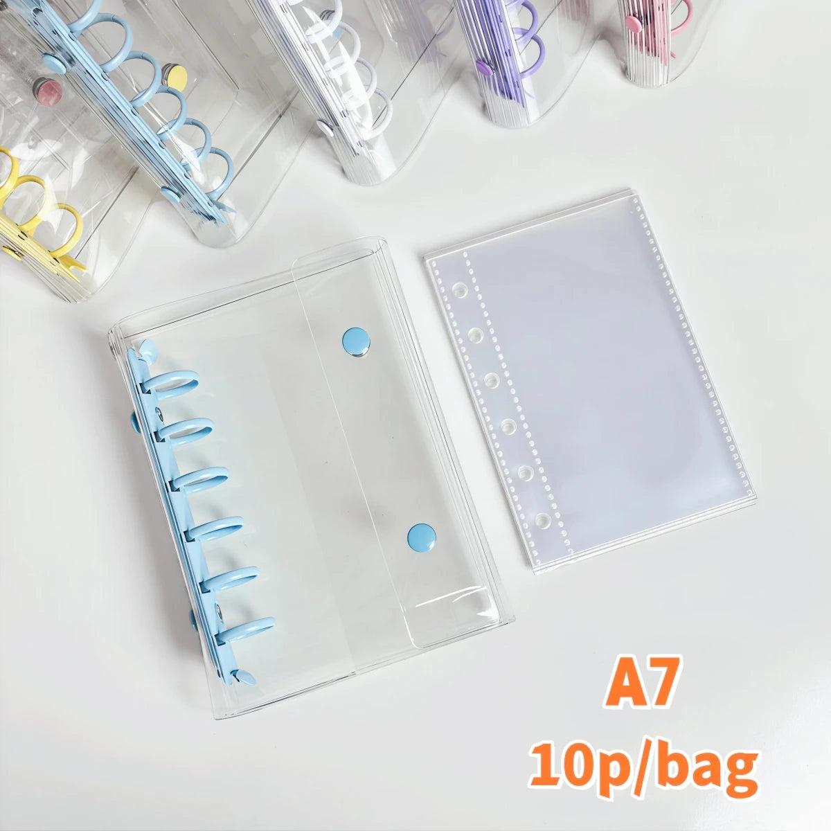 A clear double-button binder for stickers and journaling with colorful plastic accessories.