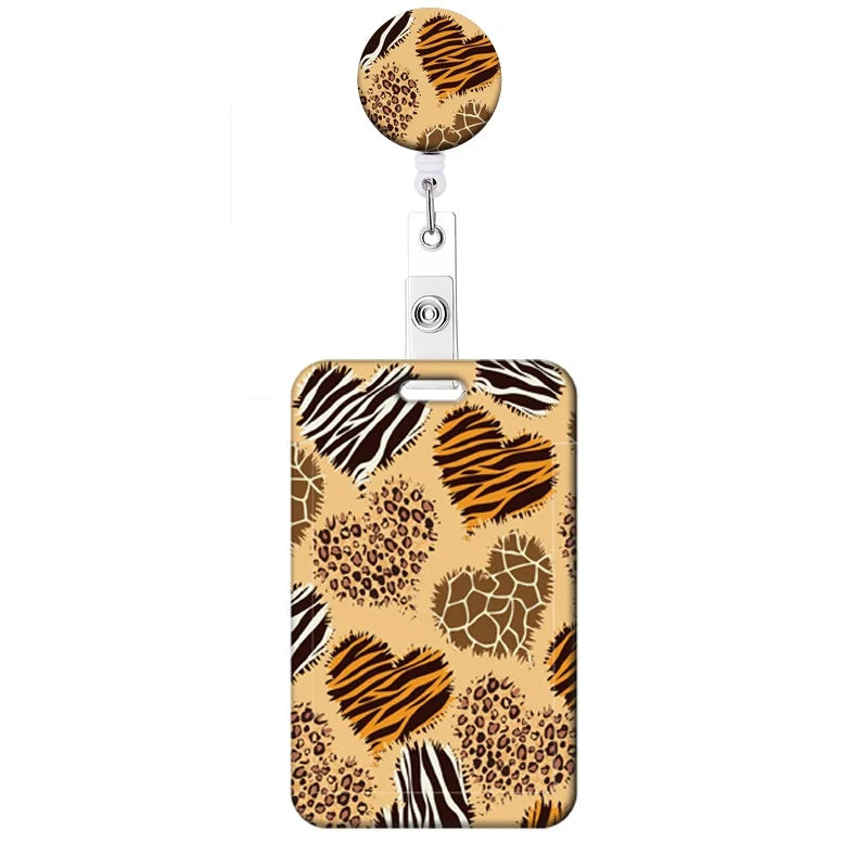 A leopard print retractable badge holder with a gold and brown pattern.