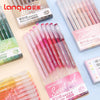 A collection of Langquo colored gel pens in various shades, including pink and green, displayed on a light blue background.