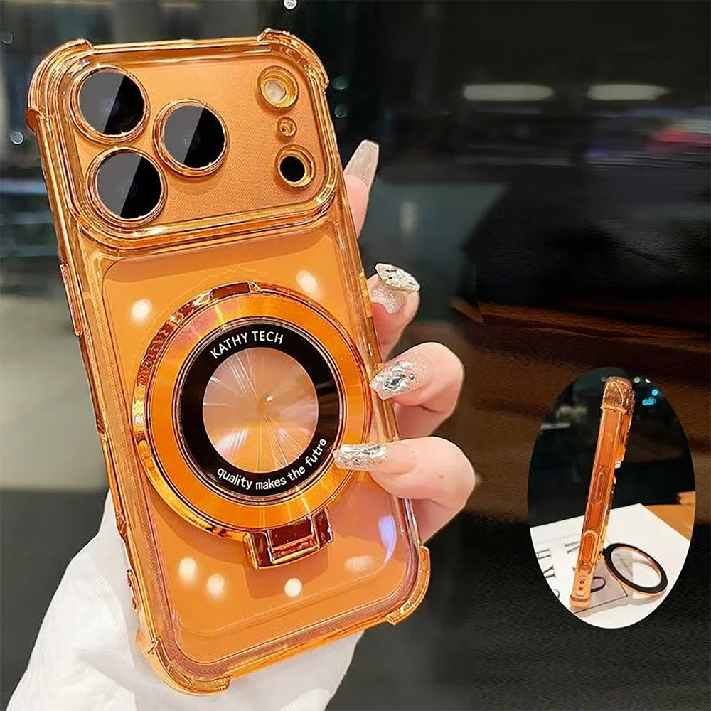 An orange iPhone magnetic stand case with a kickstand is held in a hand, showing the lens protection feature.