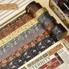 A collection of vintage floral washi tape strips in various patterns and colors displayed next to a box.