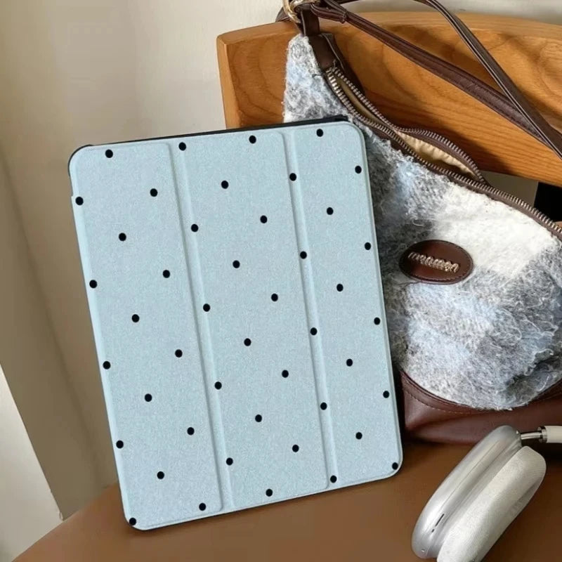Light blue acrylic protective skin designed for iPad cases resting on a wooden surface.
