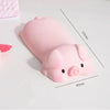 Pink ergonomic wrist rest shaped like a pig for use with a mouse or keyboard.