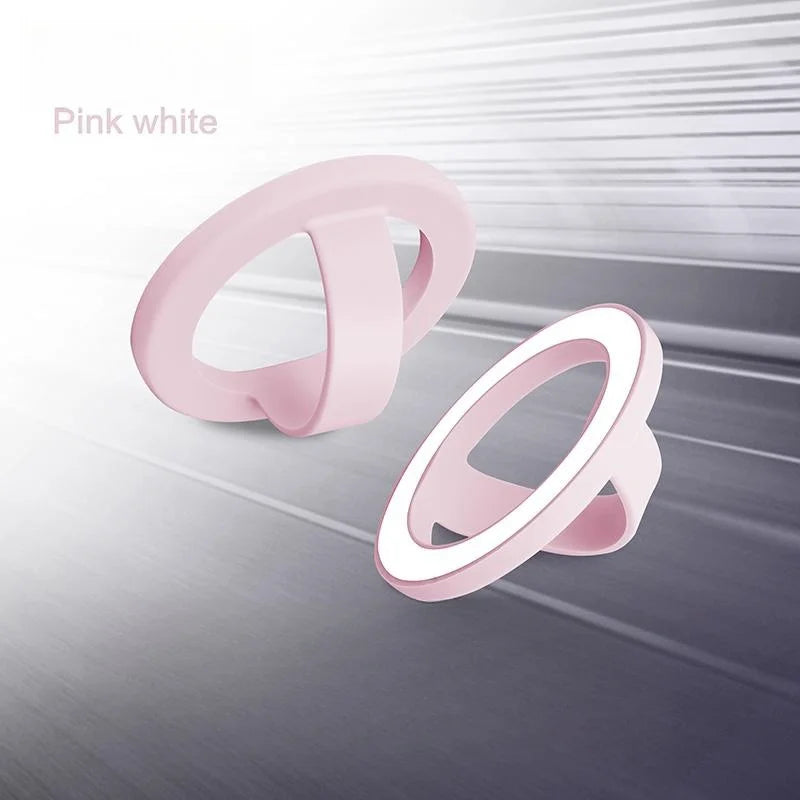 Pink white magnetic silicone phone grip with a foldable stand shown in a light gray background.