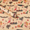 Christmas wrapping paper featuring Santa, reindeer, and evergreen tree designs on light beige paper.