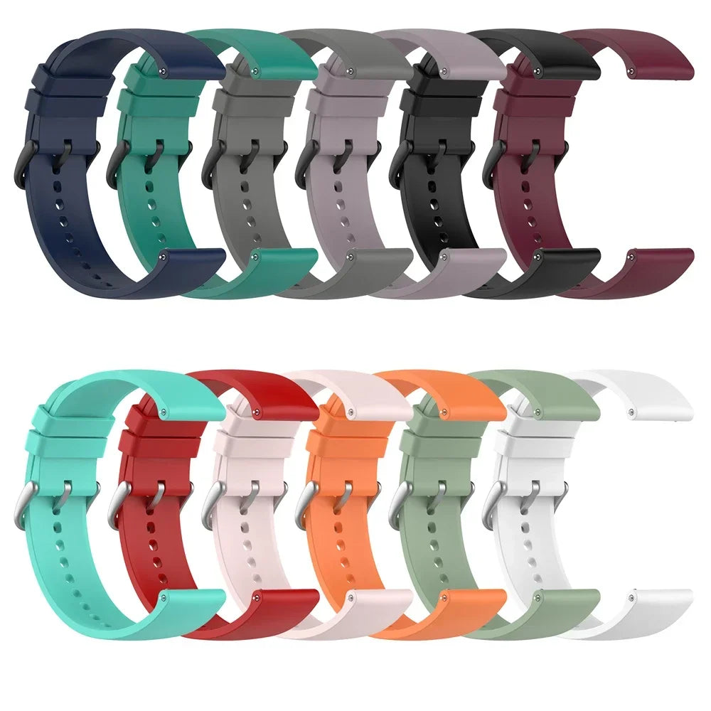 A collection of silicone watch bands in various colors including blue, green, purple, black, and maroon.