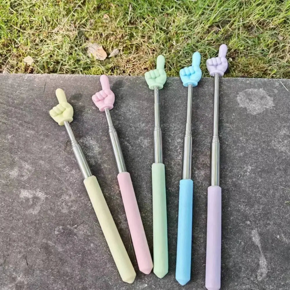 A set of five telescopic stainless steel teaching pointers with colorful silicone tips resting on a gray surface.
