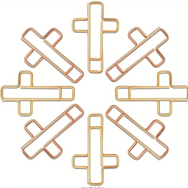 A circular arrangement of gold and rose gold decorative paper clips.