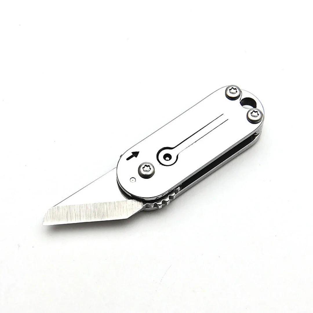 A compact stainless steel pocket knife with a blade and a keychain attachment.