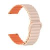 A beige watch band with an orange magnetic loop closure shown from the side.
