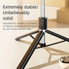 A close-up view of a black selfie stick with a tripod base and a silver extension, demonstrating stability features.