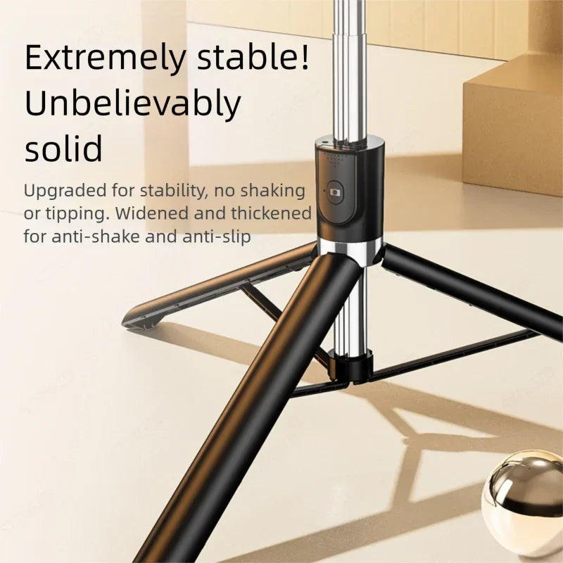 A close-up view of a black selfie stick with a tripod base and a silver extension, demonstrating stability features.