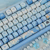 Blue sea themed PBT keycaps for a mechanical keyboard showing various light blue and white keys