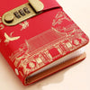 A red personal finance budget binder with a gold lock and decorative patterns on the cover.