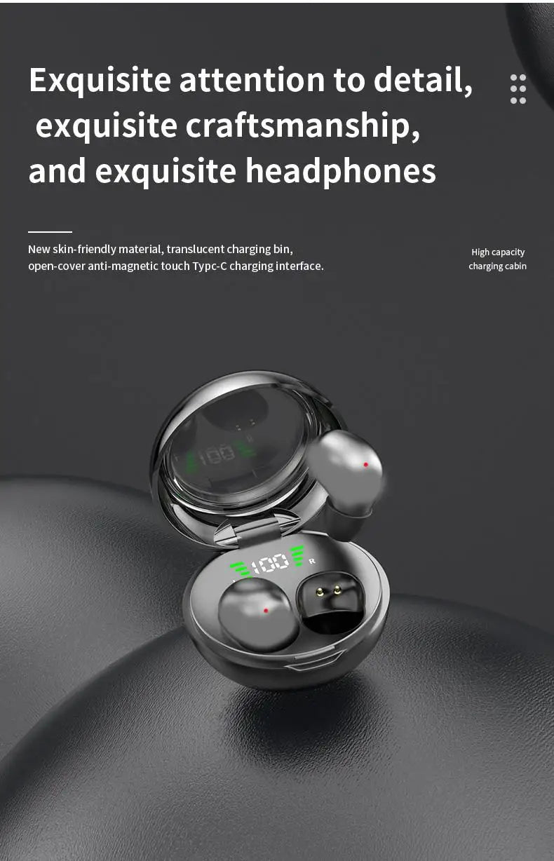 A close-up view of a pair of silver wireless earbuds resting on a dark gray surface.