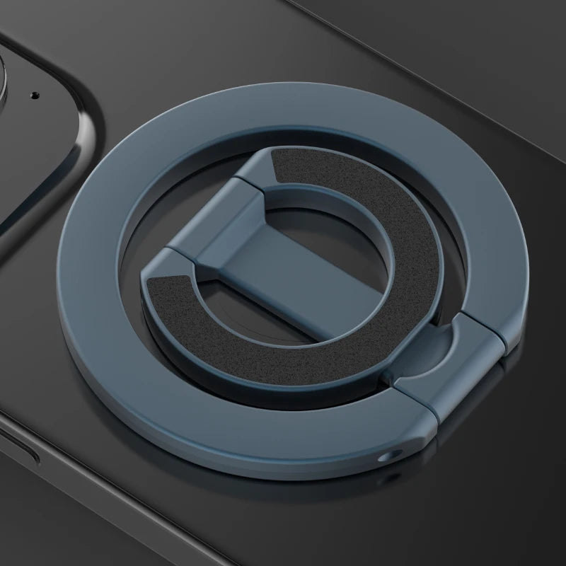A close-up view of a MagSafe double-sided phone ring holder with a matte blue finish.